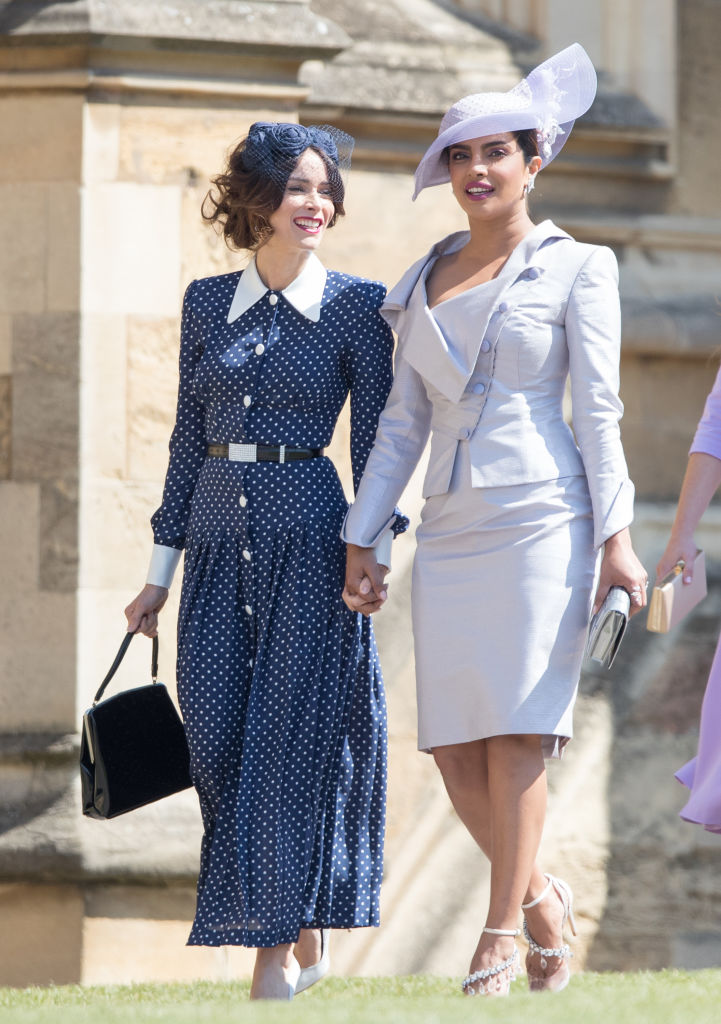 WINDSOR, ENGLAND - MAY 19: Abigail Spencer (L) and Priyanka Chopra attend the wedding of Prince Harry to Ms Meghan Markle at St George's Chapel, Windsor Castle on May 19, 2018 in Windsor, England. Prince Henry Charles Albert David of Wales marries Ms. Meghan Markle in a service at St George's Chapel inside the grounds of Windsor Castle. Among the guests were 2200 members of the public, the royal family and Ms. Markle's Mother Doria Ragland. (Photo by Pool/Samir Hussein/WireImage)