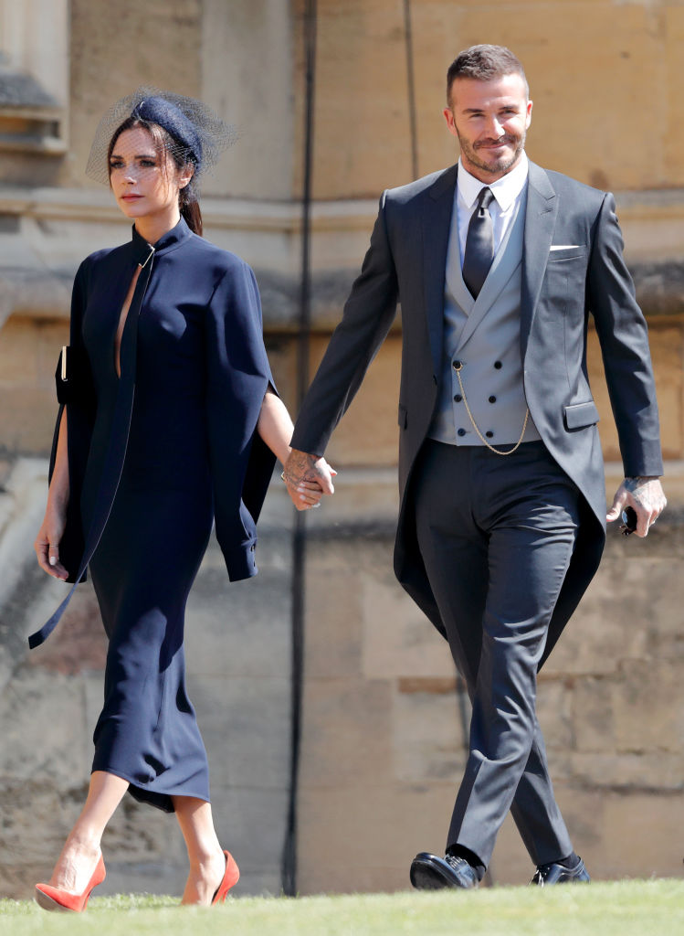 WINDSOR, UNITED KINGDOM - MAY 19: (EMBARGOED FOR PUBLICATION IN UK NEWSPAPERS UNTIL 24 HOURS AFTER CREATE DATE AND TIME) Victoria Beckham and David Beckham attend the wedding of Prince Harry to Ms Meghan Markle at St George's Chapel, Windsor Castle on May 19, 2018 in Windsor, England. Prince Henry Charles Albert David of Wales marries Ms. Meghan Markle in a service at St George's Chapel inside the grounds of Windsor Castle. Among the guests were 2200 members of the public, the royal family and Ms. Markle's Mother Doria Ragland. (Photo by Max Mumby/Indigo/Getty Images)