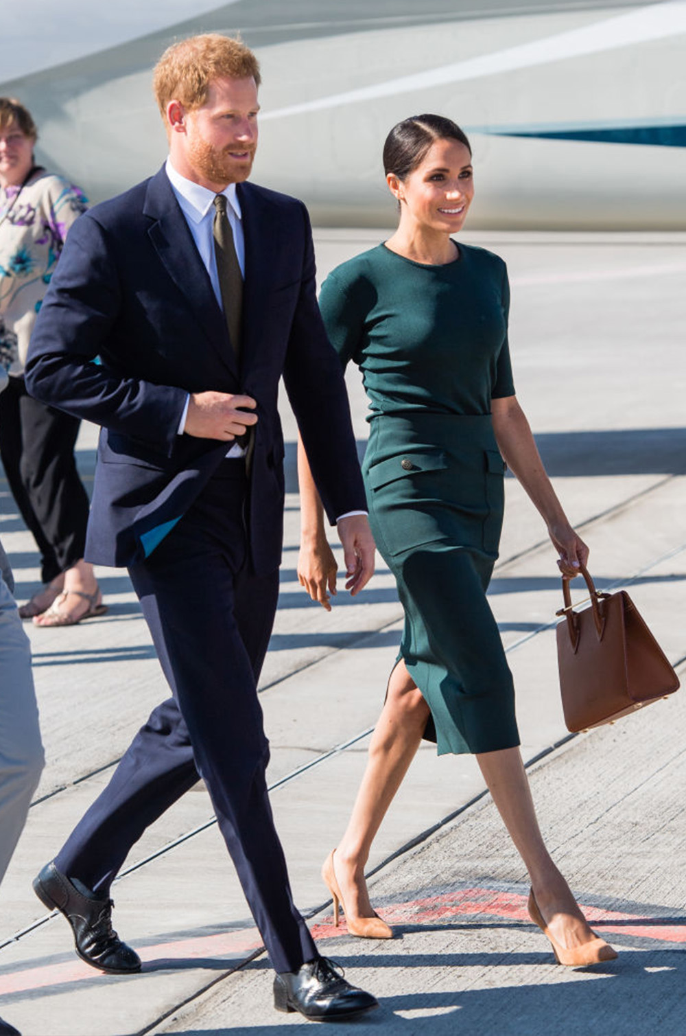 July 10, 2018: Prince Harry, Duke of Sussex and Meghan, Duchess of Sussex arrive at Dublin Airport. Meghan opts for an emerald green Givenchy number, fitting in both senses of the word given that Ireland is known as the Emerald Isle. A hue that sister-in-law Kate Middleton also frequents on the likes of St Patrick’s Day. Shoes, also by Givenchy, and bag by Strathberry complete this regal ensemble.