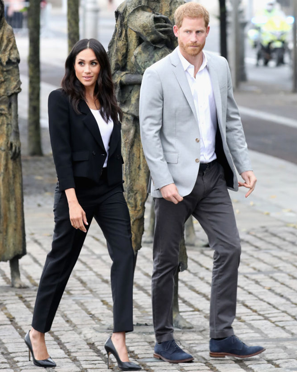 July 11, 2018: The Duchess channelling her former Suits character in a chic pair of black cigarette pants with a matching blazer which she wore over a simple white top.