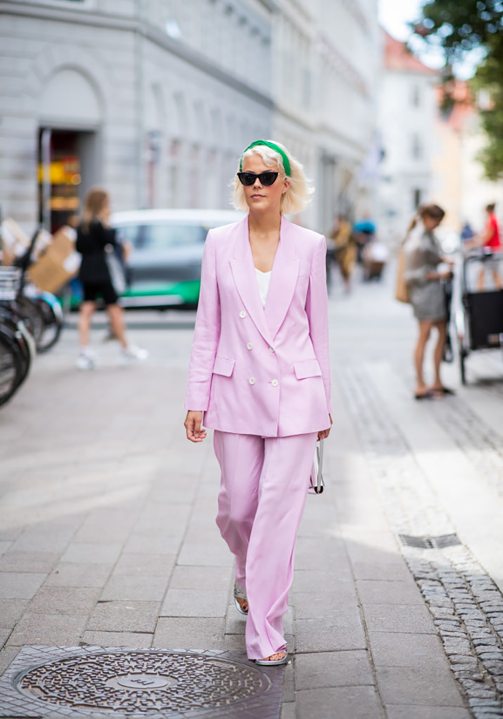 COPENHAGEN, DENMARK - AUGUST 07: A guest wearing pink oversized suit seen outside Blanche during the Copenhagen Fashion Week Spring/Summer 2019 on August 7, 2018 in Copenhagen, Denmark. (Photo by Christian Vierig/Getty Images)