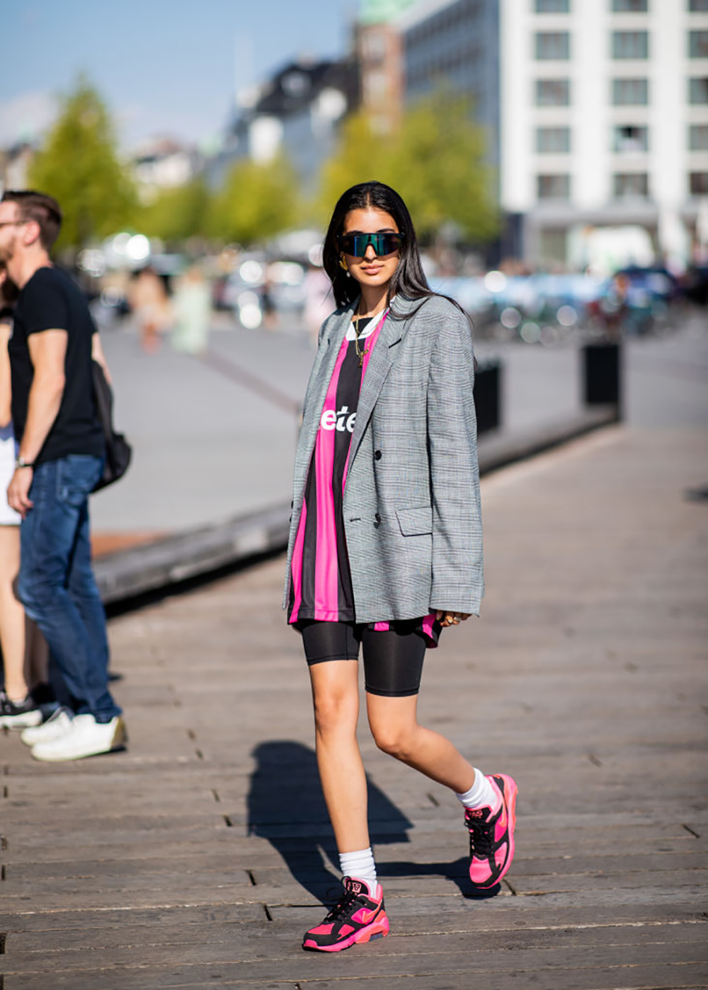 COPENHAGEN, DENMARK - AUGUST 09: A guest wearing striped tshirt, cycle pants, grey blazer jacket is seen outside Munthe during the Copenhagen Fashion Week Spring/Summer 2019 on August 9, 2018 in Copenhagen, Denmark. (Photo by Christian Vierig/Getty Images)