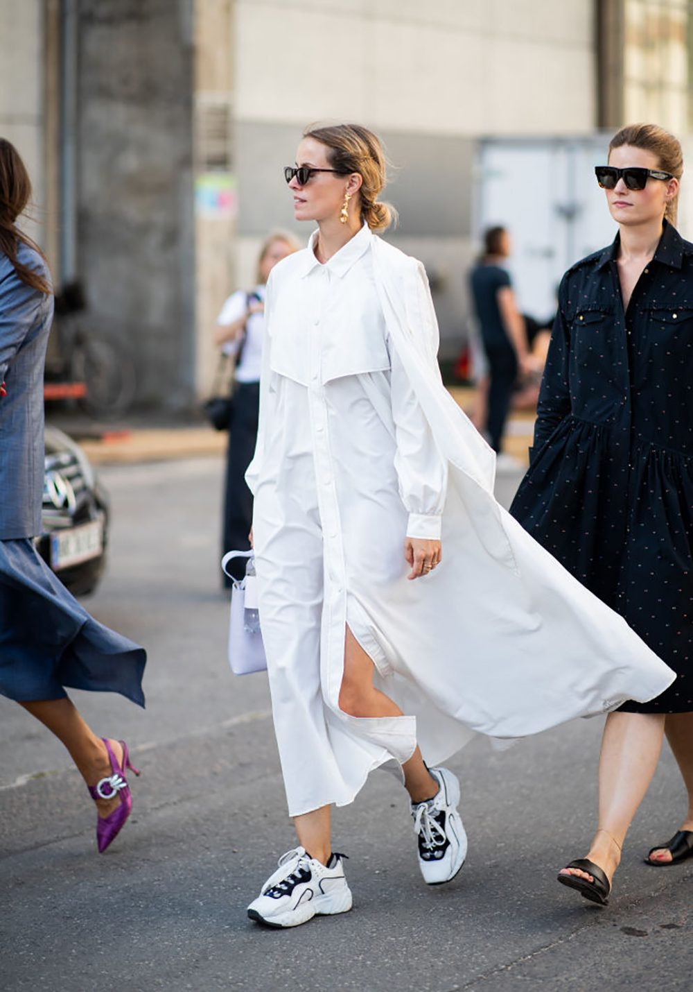 COPENHAGEN, DENMARK - AUGUST 09: A guest wearing white dress is seen outside Ganni during the Copenhagen Fashion Week Spring/Summer 2019 on August 9, 2018 in Copenhagen, Denmark. (Photo by Christian Vierig/Getty Images)