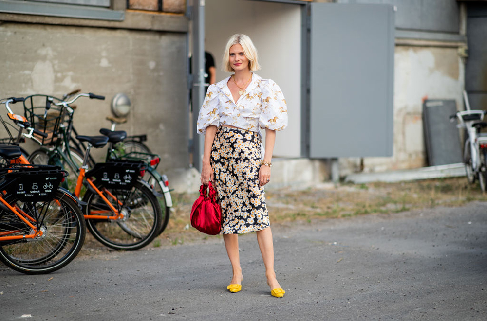 COPENHAGEN, DENMARK - AUGUST 09: Pandora Sykes wearing blouse and skirt with floral print seen outside Ganni during the Copenhagen Fashion Week Spring/Summer 2019 on August 9, 2018 in Copenhagen, Denmark. (Photo by Christian Vierig/Getty Images)