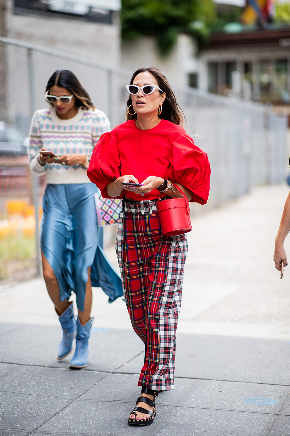 NEW YORK, NY - SEPTEMBER 08: A guest wearing ruffled top, checked pants is seen outside Dion Lee during New York Fashion Week Spring/Summer 2019 on September 8, 2018 in New York City. (Photo by Christian Vierig/Getty Images)