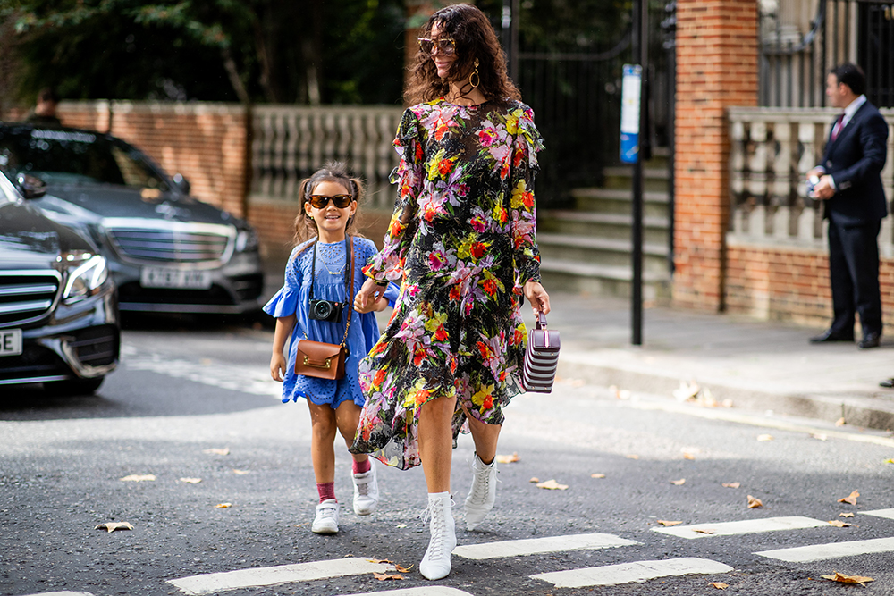LONDON, ENGLAND - SEPTEMBER 16: Hedvig Sagfjord Opshaug with her child is seen outside Preen during London Fashion Week September 2018 on September 16, 2018 in London, England. (Photo by Christian Vierig/Getty Images)