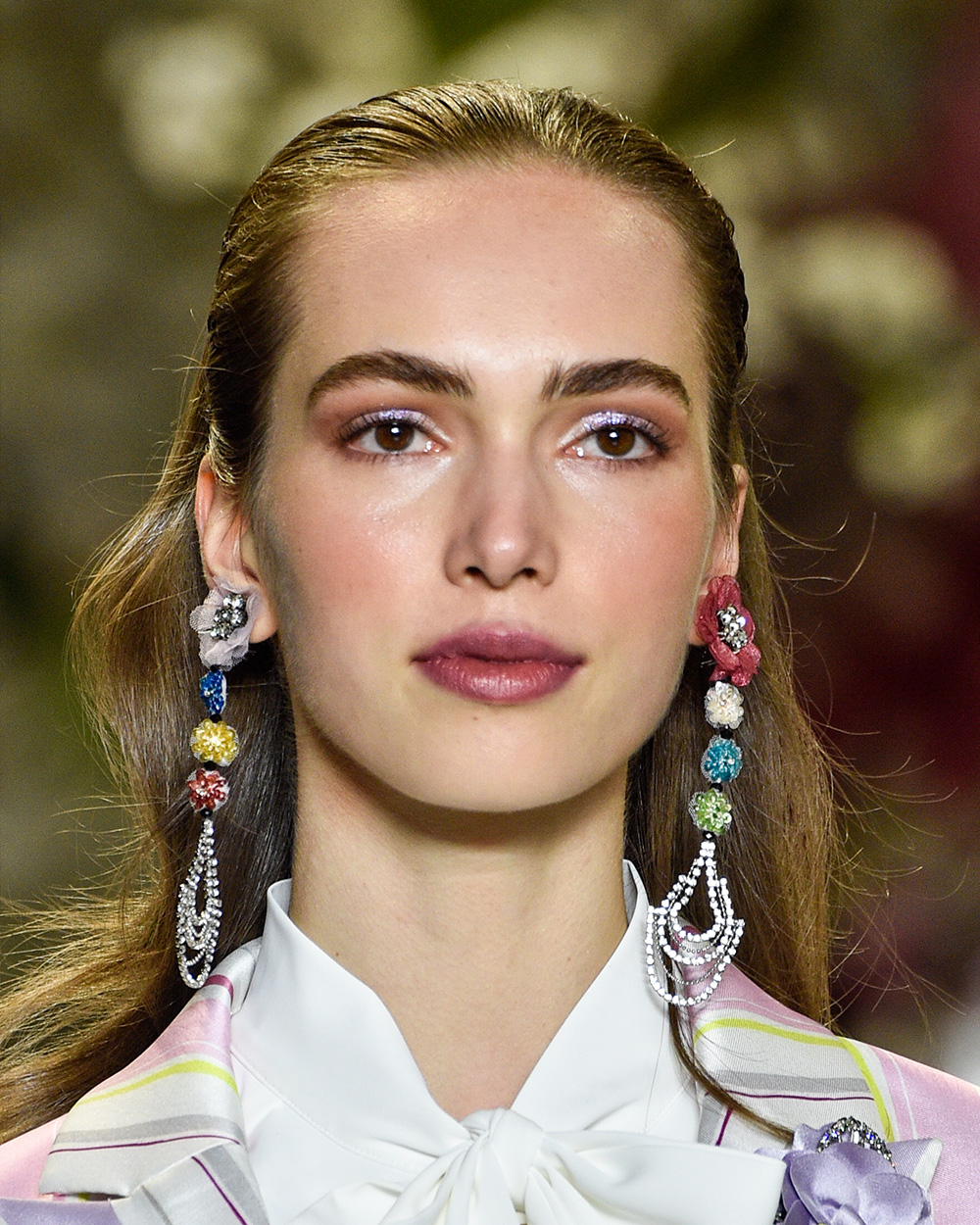 The best beauty looks from NYFW | Badgley Mishka Iridescent lids made a statement at Badgley Mishka this NYFW, paired with peach blush and pink lips.