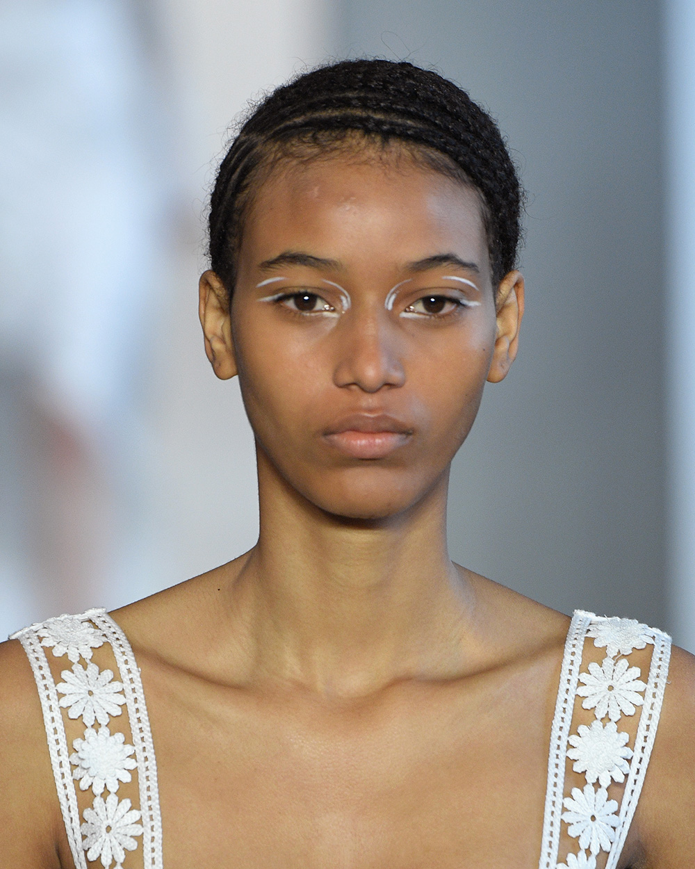 The best beauty looks from NYFW Self Portrait Skin was kept dewy and simple at Self Portrait whilst modern, graphic white liner was scribbled around the eyes in different shapes and patterns.