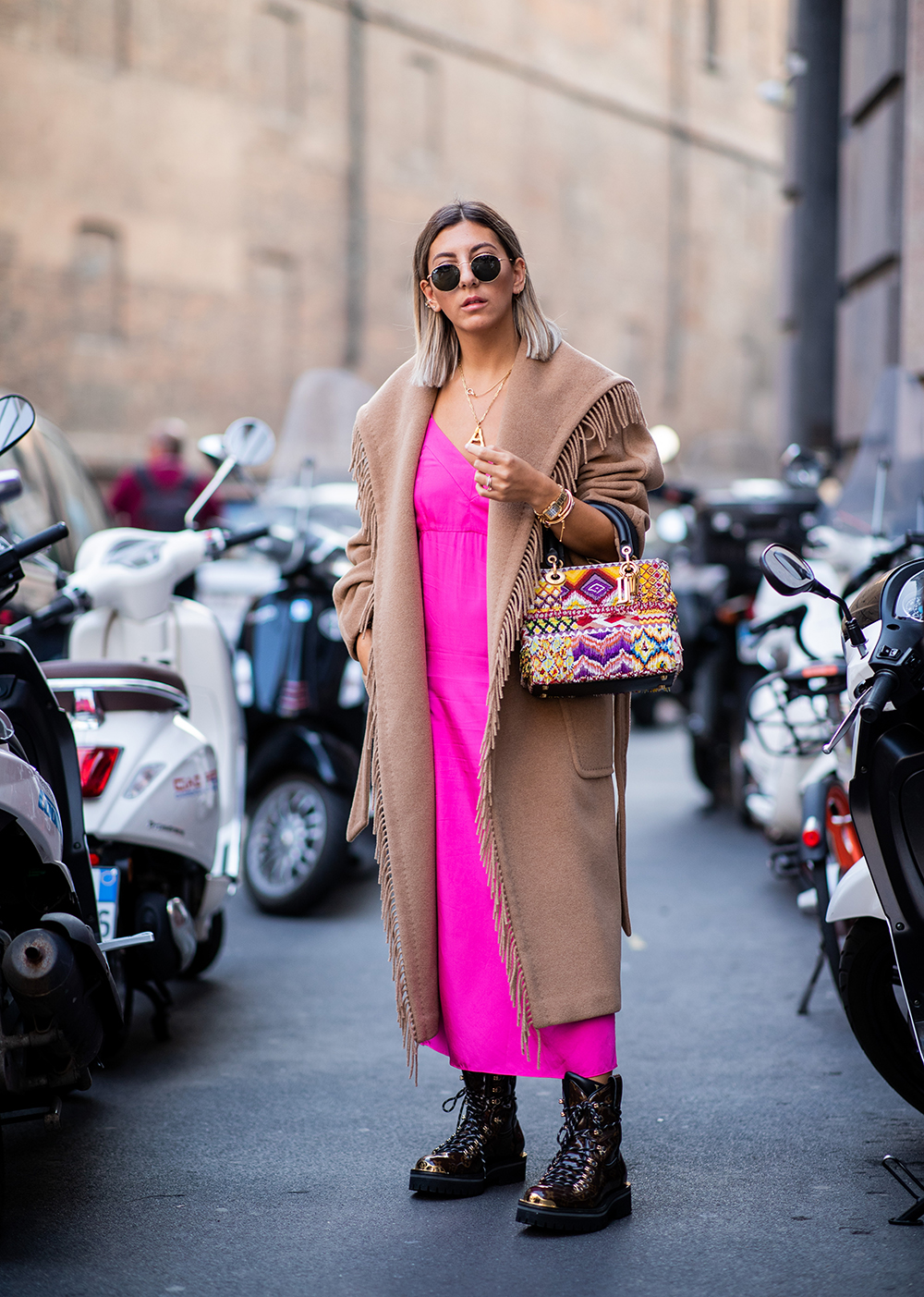 MILAN, ITALY - SEPTEMBER 20: Aylin Koenig wearing pink dress, beige coat, Dior bag is seen outside Max Mara during Milan Fashion Week Spring/Summer 2019 on September 20, 2018 in Milan, Italy. (Photo by Christian Vierig/Getty Images)