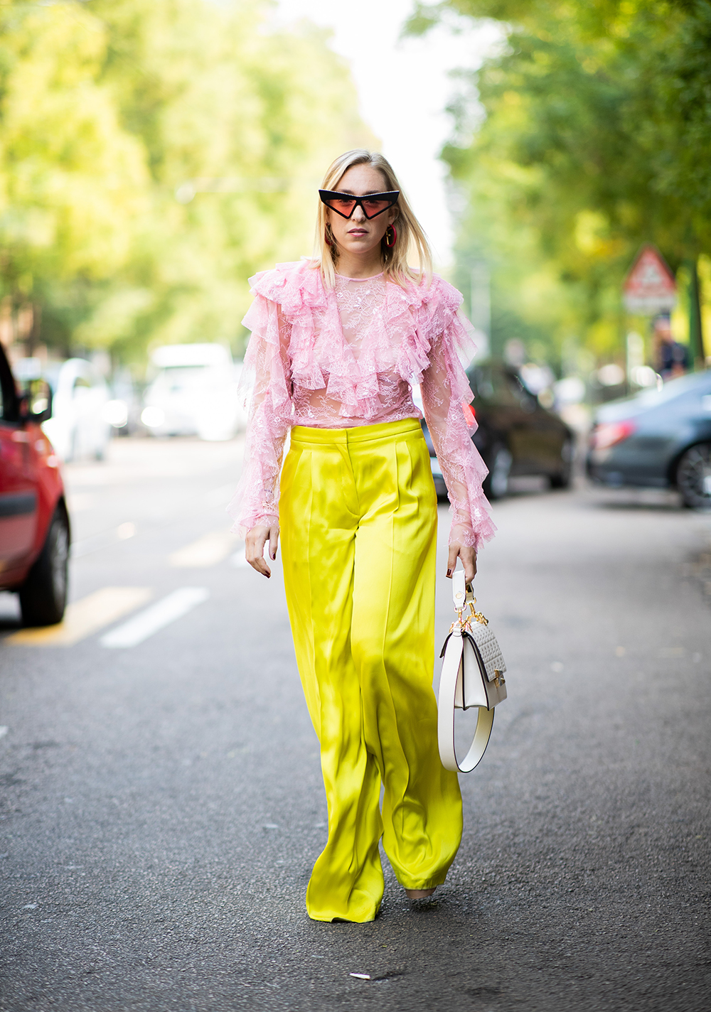 MILAN, ITALY - SEPTEMBER 20: Sonia Lyson wearing yellow pants Rochas, pink top Philosophy, Gucci bag, sunglasses Fendi is seen outside Fendi during Milan Fashion Week Spring/Summer 2019 on September 20, 2018 in Milan, Italy. (Photo by Christian Vierig/Getty Images)