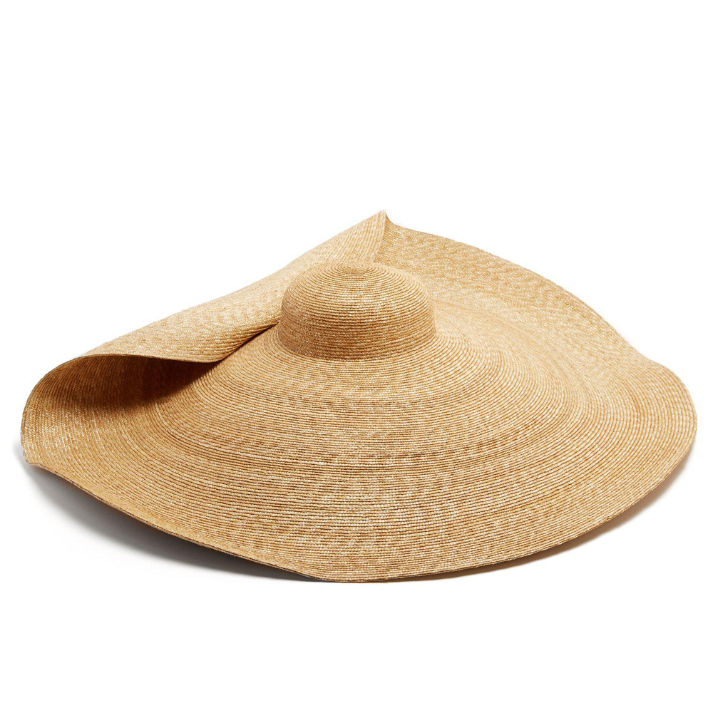 Jacquemus La Bomba Hat The giant woven hat was the subject of much controversy thanks to fashion industry watchdog @DietPrada. It sold out worldwide and kickstarted an Instagram trend for hiding behind big hats.(Lyst)