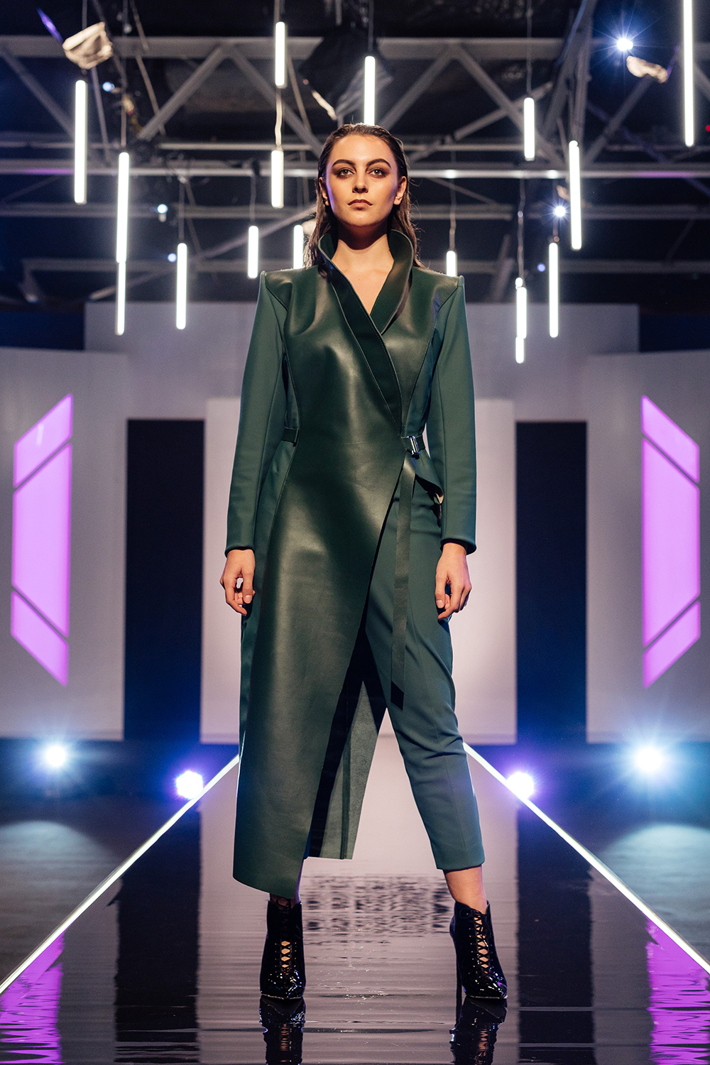 Judy Design: A structural asymmetric green wrap coat featuring two different fabrics with very different properties. One, a leather, the other, a georgette/chiffon. The coat was worn of a slim 7/8 trouser. Judges’ comments: Georgia: “I love the forest green. But I do wish the entire jacket was leather.” Sally-Ann: “It is very impressive.” Benny: “You’ve achieved fierce and strong and confident.” Paris: “I love the juxtaposition of the fabrics and the craftsmanship is amazing.”