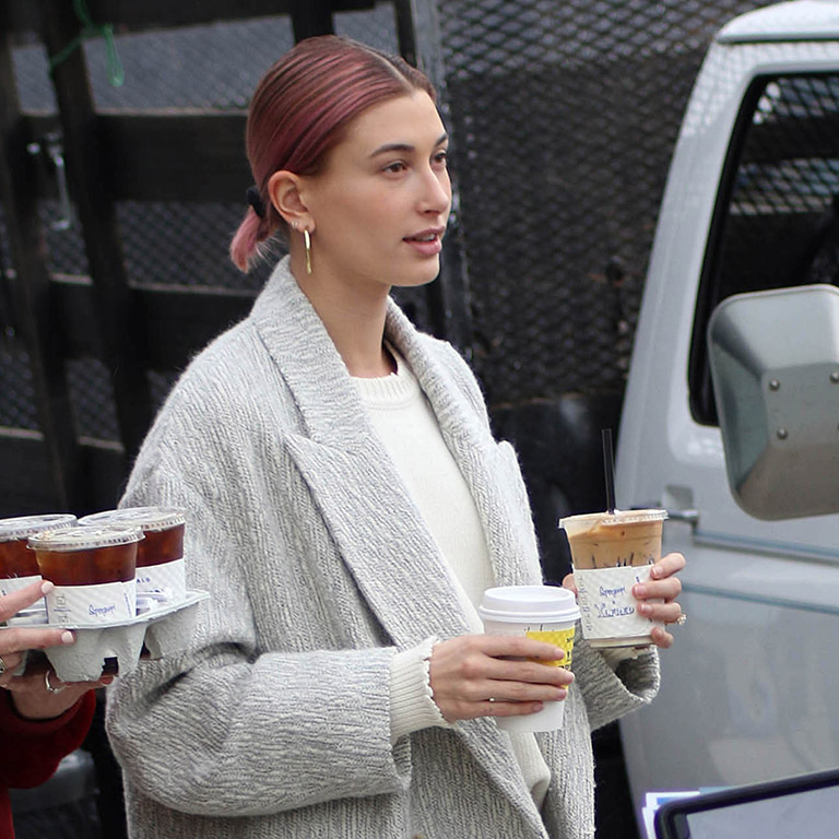 January 2019: While running coffee errands, Hailey makes casual look somewhat sophisticated by pulling her pink strands into a low ponytail and tieing with a black scrunchie (which she is rarely seen without). Perfect for:  Days where you're time poor but still want to show you have a personality. 