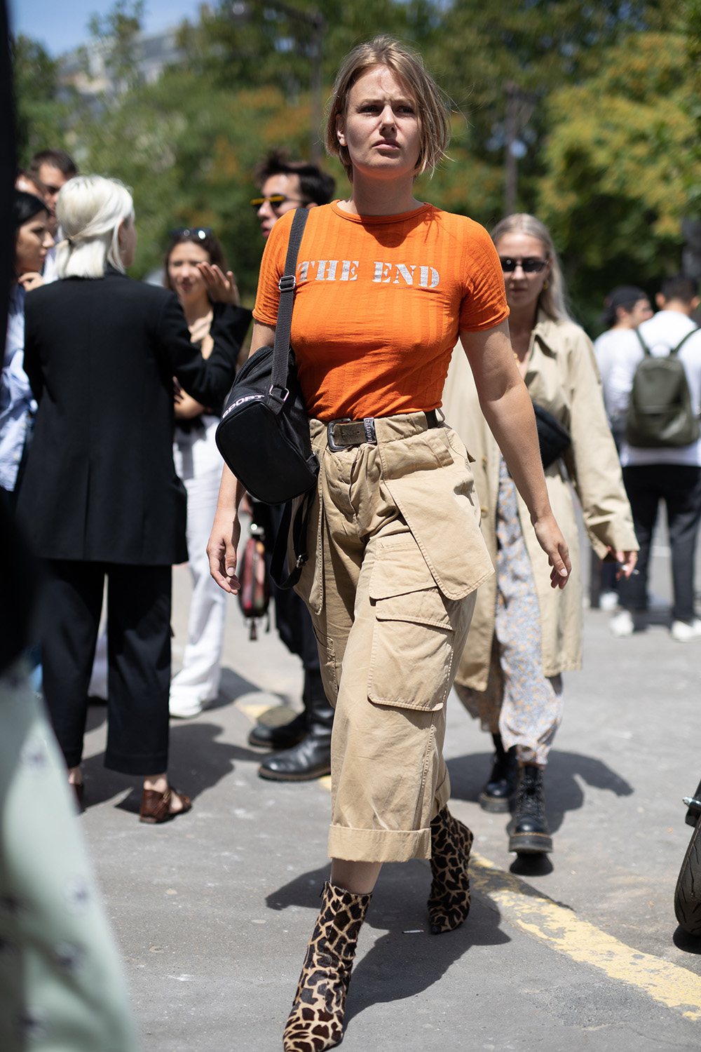 Precious Cargo: The practical pant trend that’s replacing your mom jeans (and fast) | PARIS, FRANCE - JUNE 21: A guest is seen on the street during Paris Men's Fashion Week S/S 2019 wearing an orange shirt with khaki cargo pants and animal print shoes on June 21, 2018 in Paris, France. (Photo by Matthew Sperzel/Getty Images)