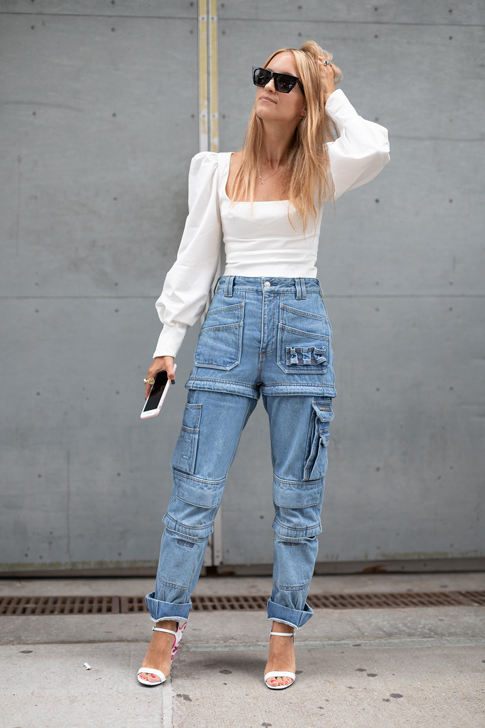 Precious Cargo: The practical pant trend that’s replacing your mom jeans (and fast) | NEW YORK, NY - SEPTEMBER 07: A guest is seen on the street during New York Fashion Week SS19 wearing white shirt with washed blue denim cargo pants on September 7, 2018 in New York City. (Photo by Matthew Sperzel/Getty Images)
