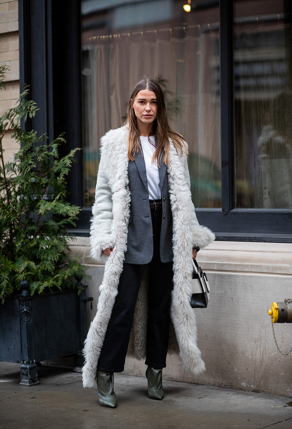 NEW YORK, NEW YORK - FEBRUARY 08: Sophia Roe is seen wearing shearling coat, black white bag outside Nanushka during New York Fashion Week Autumn Winter 2019 on February 08, 2019 in New York City. (Photo by Christian Vierig/Getty Images)