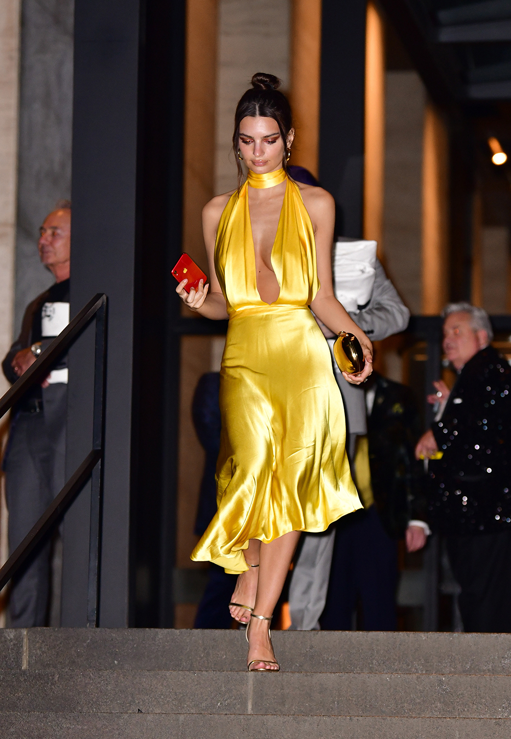 Emily Ratajkowski was one of a few guests who didn't wear Marc Jacobs, opting for a gold Saks Potts gown instead.