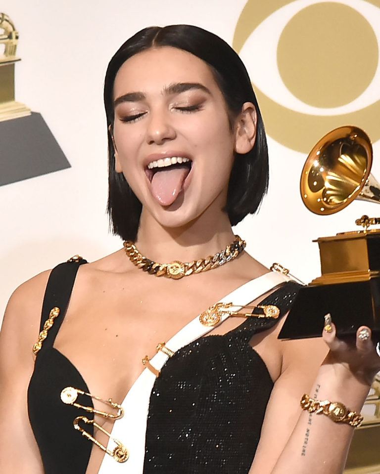 Dua Lipa sticking her tongue out at the Grammy Awards