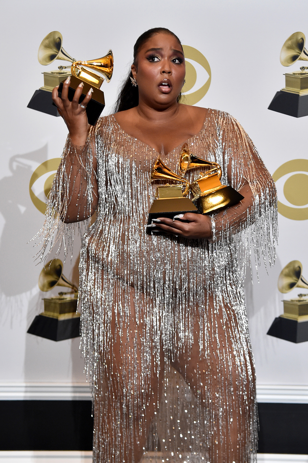 Lizzo wearing silver at the grammys