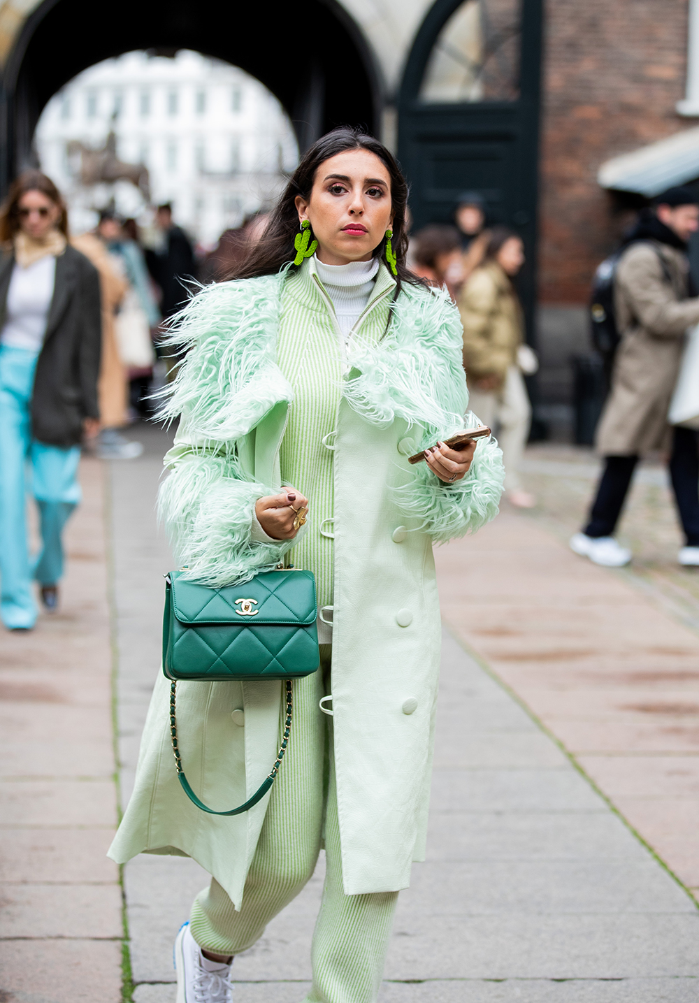 COPENHAGEN, DENMARK - JANUARY 29: A guest is seen wearing green Chanel bag, coat and pants outside Mfpen during Copenhagen Fashion Week Autumn/Winter 2020 Day 2 on January 29, 2020 in Copenhagen, Denmark. (Photo by Christian Vierig/Getty Images)
