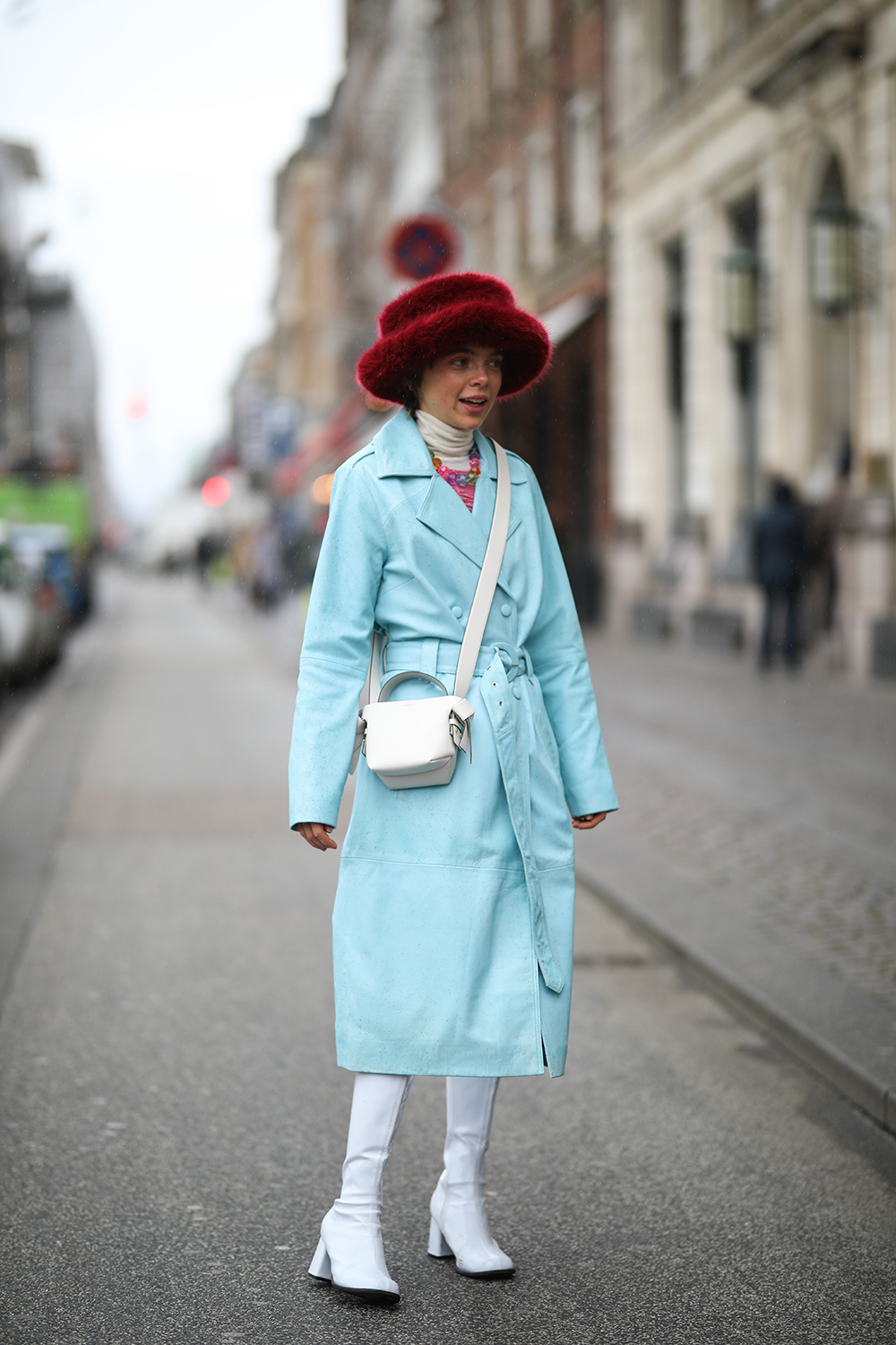 COPENHAGEN, DENMARK - JANUARY 29: Fashion Week guest wearing a blue coat and white bag before Helmstedt on January 29, 2020 in Copenhagen, Denmark. (Photo by Jeremy Moeller/Getty Images)