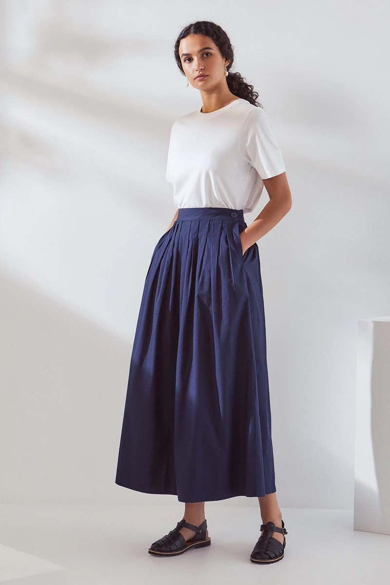 Navy long pleated skirt by Kowtow