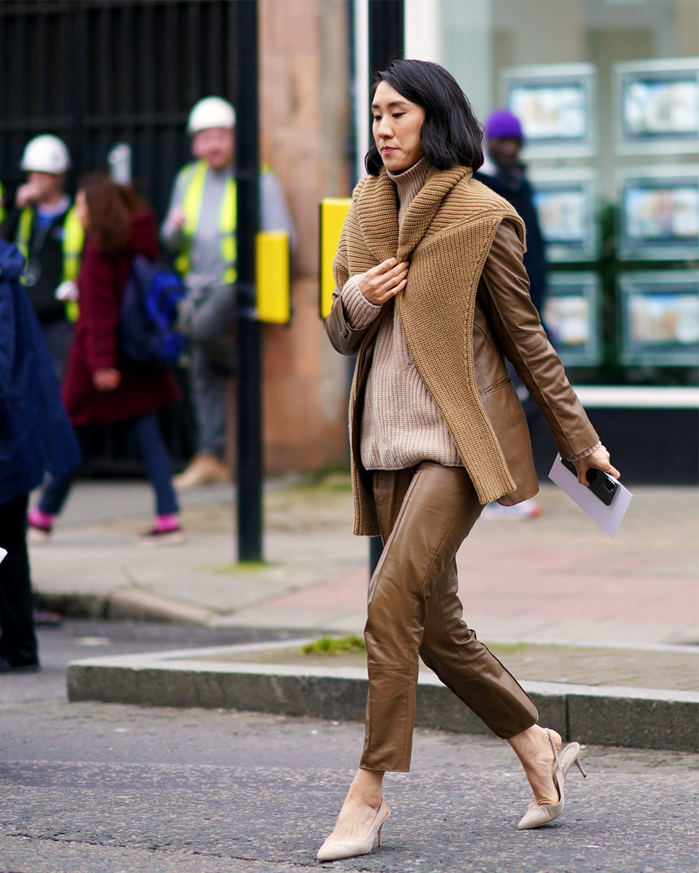 Eva Chen wears a Petra Petrovo leather suit and Manolo Blahnik heels during London Fashion Week 2020.