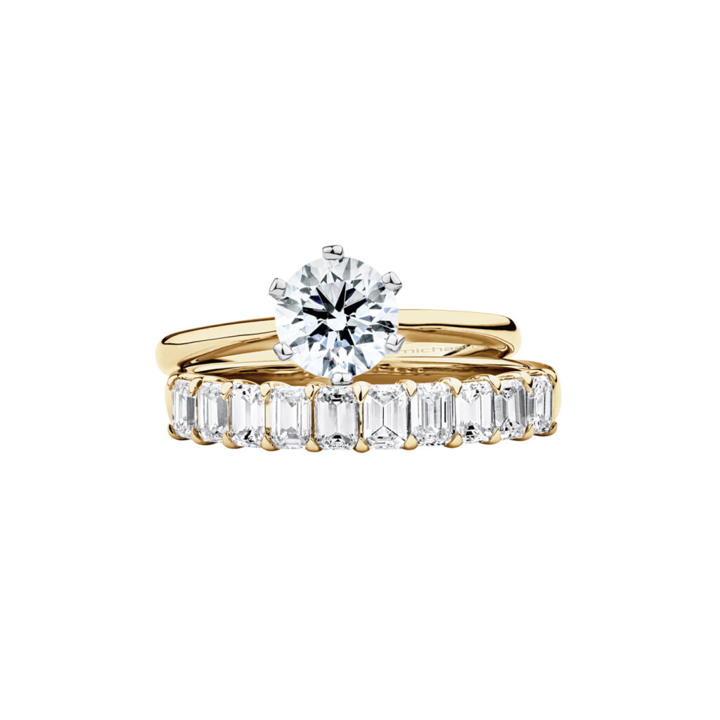 Solitaire Engagement Ring with a 1 Carat TW Diamond with the De Beers Code of Origin in 18kt Yellow and White Gold, $22,999 (top), and Wedding Ring with 0.80 Carat TW of Emerald Cut Diamonds in 14kt Yellow Gold, $4499 (bottom)