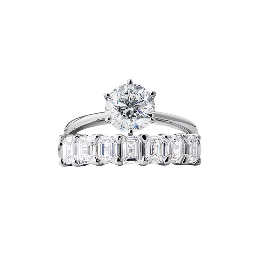 Certified Solitaire Engagement Ring with a 1 Carat TW Diamond in 18kt White Gold, $10,999 (top), and 7 Stone Claw Wedding Ring with 1.61 Carat TW of Diamonds in 14kt White Gold, $8499 (bottom)