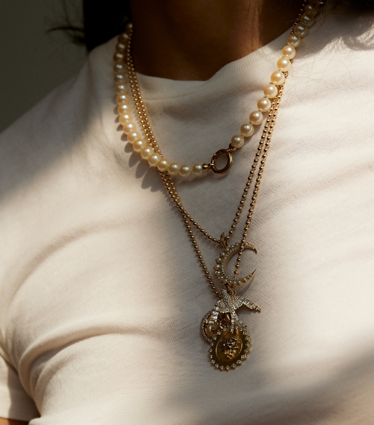 Image of a woman's torso wearing layers of Storrow necklaces from Lulu's Collective. Supplied.