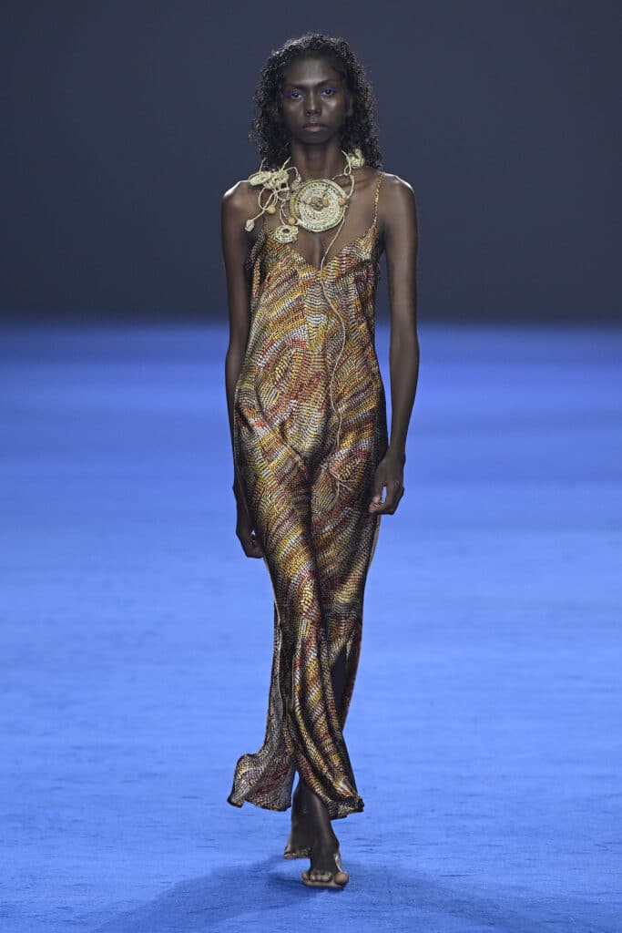 SYDNEY, AUSTRALIA - MAY 16: Model Cindy Rostron walks the runway in a design by Miimi & Jinda during the David Jones Indigenous Fashion Projects show during Australian Fashion Week Presented By Pandora 2024 at Carriageworks on May 16, 2024 in Sydney, Australia. (Photo by Stefan Gosatti/Getty Images for AFW)