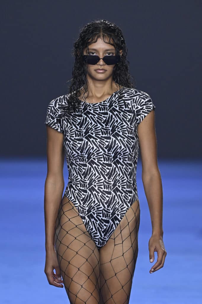 SYDNEY, AUSTRALIA - MAY 16: A model walks the runway in a design by Irrah Swim during the David Jones Indigenous Fashion Projects show during Australian Fashion Week Presented By Pandora 2024 at Carriageworks on May 16, 2024 in Sydney, Australia. (Photo by Stefan Gosatti/Getty Images for AFW)