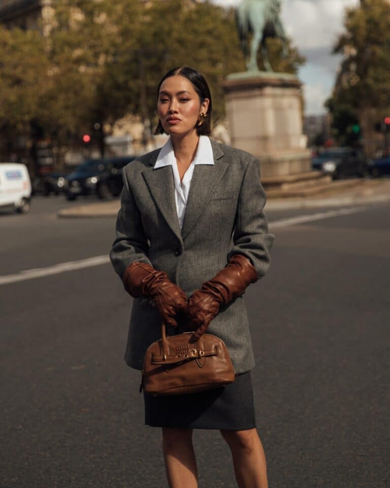 Fashion week guests casually posing in chic, effortless outfits backstage at Fashion Week