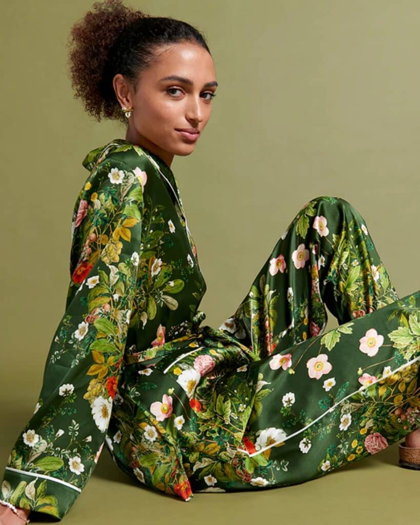 Woman wearing luxurious modal pajamas from Papinelle x Karen Walker collection