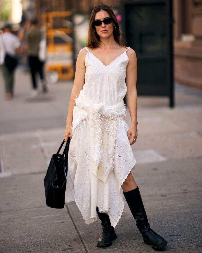 Woman wearing white maxi dress on the streets of New York